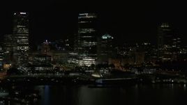 5.7K aerial stock footage approach skyscraper and museum from Lake Michigan at night, Downtown Milwaukee, Wisconsin Aerial Stock Footage | DX0002_157_043
