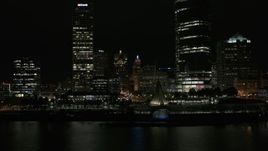 5.7K aerial stock footage circle around the lakefront museum near skyscrapers at night, Downtown Milwaukee, Wisconsin Aerial Stock Footage | DX0002_157_047