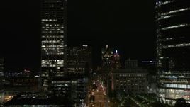 5.7K aerial stock footage fly over museum near skyscrapers, reveal city street at night, Downtown Milwaukee, Wisconsin Aerial Stock Footage | DX0002_157_053