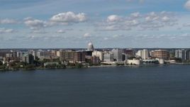 5.7K aerial stock footage slowly fly away from lakefront city buildings in Madison, Wisconsin Aerial Stock Footage | DX0002_158_005