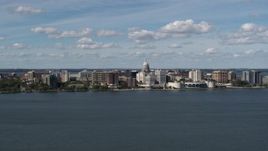 5.7K aerial stock footage a reverse view of lakefront city buildings in Madison, Wisconsin Aerial Stock Footage | DX0002_158_007