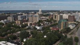 5.7K aerial stock footage descend with view of of apartment complexes near the capitol dome in Madison, Wisconsin Aerial Stock Footage | DX0002_158_016