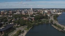5.7K aerial stock footage flyby and fly and then approach apartment complexes around the capitol dome in Madison, Wisconsin Aerial Stock Footage | DX0002_158_020