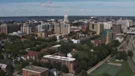 5.7K aerial stock footage of a reverse view of apartment complexes around the capitol dome, then descend, Madison, Wisconsin Aerial Stock Footage | DX0002_158_022