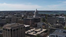 5.7K aerial stock footage of the capitol dome surrounded by office buildings, Madison, Wisconsin Aerial Stock Footage | DX0002_158_023