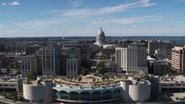 5.7K aerial stock footage of the capitol dome and office buildings, reveal convention center, Madison, Wisconsin Aerial Stock Footage | DX0002_158_025