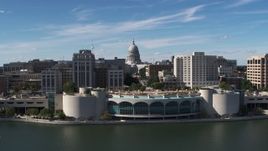 5.7K aerial stock footage approach capitol dome, office buildings, and convention center, Madison, Wisconsin Aerial Stock Footage | DX0002_158_027
