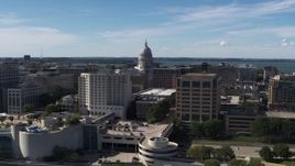 5.7K aerial stock footage flyby the convention center, ascend for view of capitol dome, office buildings, Madison, Wisconsin Aerial Stock Footage | DX0002_158_033
