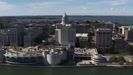 5.7K aerial stock footage of the capitol dome and office buildings, seen while from the convention center, Madison, Wisconsin Aerial Stock Footage | DX0002_158_037