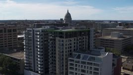 5.7K aerial stock footage of the capitol dome seen while descending by condo complexes, Madison, Wisconsin Aerial Stock Footage | DX0002_158_039