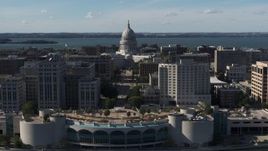 5.7K aerial stock footage of the capitol dome seen while ascending past office buildings, Madison, Wisconsin Aerial Stock Footage | DX0002_160_001