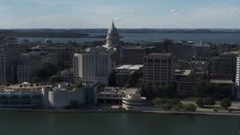 5.7K aerial stock footage of the capitol seen from lakefront office buildings, Madison, Wisconsin Aerial Stock Footage | DX0002_160_004
