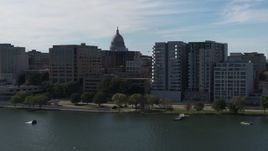 5.7K aerial stock footage of the dome of the capitol seen from lakefront office and condo complexes, Madison, Wisconsin Aerial Stock Footage | DX0002_160_005