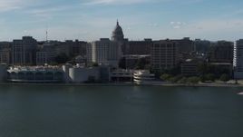 5.7K aerial stock footage dome of the capitol seen while flying away from office buildings and convention center, Madison, Wisconsin Aerial Stock Footage | DX0002_160_006