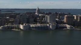 5.7K aerial stock footage ascending away from convention center with capitol and office buildings in background, Madison, Wisconsin Aerial Stock Footage | DX0002_160_009
