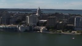 5.7K aerial stock footage of a reverse view of the convention center with capitol and office buildings in background, Madison, Wisconsin Aerial Stock Footage | DX0002_160_011