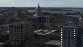 5.7K aerial stock footage focus on capitol and flyby office buildings, Madison, Wisconsin Aerial Stock Footage | DX0002_160_014