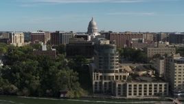 5.7K aerial stock footage focus on the capitol dome and reveal hotel in Madison, Wisconsin Aerial Stock Footage | DX0002_160_023