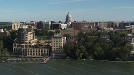 5.7K aerial stock footage focus on the capitol dome while passing lakeside hotel in Madison, Wisconsin Aerial Stock Footage | DX0002_160_024