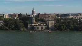 5.7K aerial stock footage approach a lakeside hotel in Madison, Wisconsin with capitol dome in background Aerial Stock Footage | DX0002_160_028
