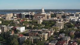 5.7K aerial stock footage reverse view of the capitol dome from lakeside apartment buildings in Madison, Wisconsin Aerial Stock Footage | DX0002_160_029