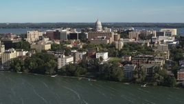 5.7K aerial stock footage reverse view of the capitol dome and lakeside apartment buildings in Madison, Wisconsin Aerial Stock Footage | DX0002_160_030