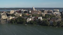 5.7K aerial stock footage approach the capitol dome and lakeside apartment buildings in Madison, Wisconsin Aerial Stock Footage | DX0002_160_031