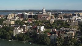 5.7K aerial stock footage fly toward the capitol dome from lakeside apartment buildings in Madison, Wisconsin Aerial Stock Footage | DX0002_160_032