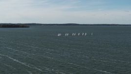 5.7K aerial stock footage of a reverse view of a group of sailboats on Lake Mendota, Madison, Wisconsin Aerial Stock Footage | DX0002_160_035
