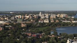 5.7K aerial stock footage wide view of the capitol dome and downtown seen from a residential neighborhood, Madison, Wisconsin Aerial Stock Footage | DX0002_161_004