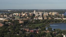 5.7K aerial stock footage flying by the capitol dome and downtown seen from a residential neighborhood, Madison, Wisconsin Aerial Stock Footage | DX0002_161_005