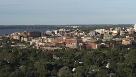 5.7K aerial stock footage of orbiting a hospital near downtown during ascent, Madison, Wisconsin Aerial Stock Footage | DX0002_161_013