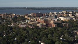 5.7K aerial stock footage of a reverse view of a hospital near downtown, Madison, Wisconsin Aerial Stock Footage | DX0002_161_014