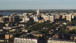 5.7K aerial stock footage flying away from and past the capitol dome and downtown buildings, Madison, Wisconsin Aerial Stock Footage | DX0002_161_020