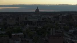 5.7K aerial stock footage of flying away from the capitol dome at sunset, Madison, Wisconsin Aerial Stock Footage | DX0002_162_001