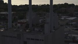 5.7K aerial stock footage orbit smoke stacks at a power plant at twilight, Madison, Wisconsin Aerial Stock Footage | DX0002_162_012