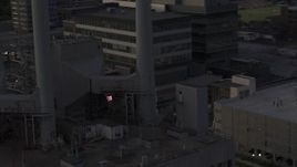 5.7K aerial stock footage close orbit of smoke stacks at a power plant at twilight, Madison, Wisconsin Aerial Stock Footage | DX0002_162_013
