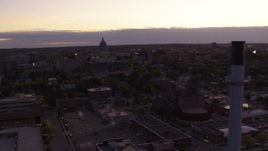 5.7K aerial stock footage flyby capitol dome to reveal smoke stacks at twilight, Madison, Wisconsin Aerial Stock Footage | DX0002_162_020