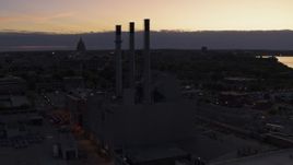 5.7K aerial stock footage descend and orbit power plant smoke stacks at twilight, Madison, Wisconsin Aerial Stock Footage | DX0002_162_021