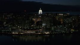 5.7K aerial stock footage focus on capitol dome while passing the convention center at night, Madison, Wisconsin Aerial Stock Footage | DX0002_162_030