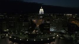 5.7K aerial stock footage passing downtown buildings while focused on the capitol at night, Madison, Wisconsin Aerial Stock Footage | DX0002_162_034