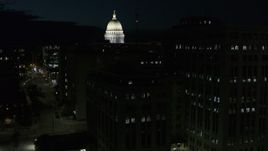 5.7K aerial stock footage view of capitol dome while descending by building at night, Madison, Wisconsin Aerial Stock Footage | DX0002_162_041