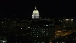 5.7K aerial stock footage descend and fly away from the capital dome at night, Madison, Wisconsin Aerial Stock Footage | DX0002_162_045