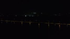 5.7K aerial stock footage of panning across a causeway on the lake at night, Madison, Wisconsin Aerial Stock Footage | DX0002_162_055