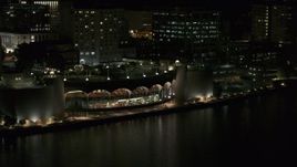 5.7K aerial stock footage orbit and approach the convention center at night, Madison, Wisconsin Aerial Stock Footage | DX0002_162_058