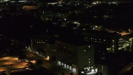 5.7K aerial stock footage orbit a hospital complex and flyby parking garage at night, Madison, Wisconsin Aerial Stock Footage | DX0002_163_020