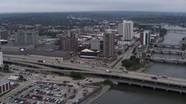 5.7K aerial stock footage a view of apartment high-rise and office buildings near bridges and river, Downtown Cedar Rapids, Iowa Aerial Stock Footage | DX0002_164_004