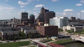 5.7K aerial stock footage the city's skyline seen while passing apartment buildings in Downtown Des Moines, Iowa Aerial Stock Footage | DX0002_165_003