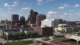 5.7K aerial stock footage the city's skyline seen while passing apartment and office buildings in Downtown Des Moines, Iowa Aerial Stock Footage | DX0002_165_004