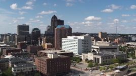 5.7K aerial stock footage the city's skyline seen while ascending past office buildings in Downtown Des Moines, Iowa Aerial Stock Footage | DX0002_165_005
